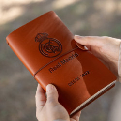 CUADERNO DE VIAJE C/GOMA ERIK REAL MADRID MARRON CTBV036